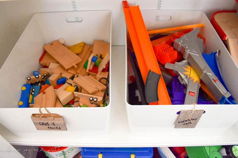 A 2 plastic bin that can be used as a storage solution for children's toys.