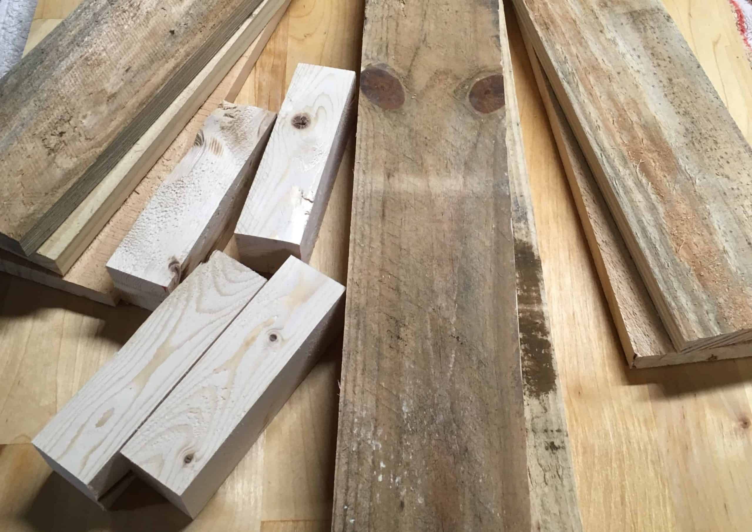 Cut wood in varying lengths and widths to make a DIY pallet crate for a rustic farmhouse decoration