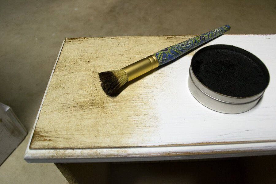 Dark wax is an essential step when that helps antique any piece of painted furniture that's been sanded