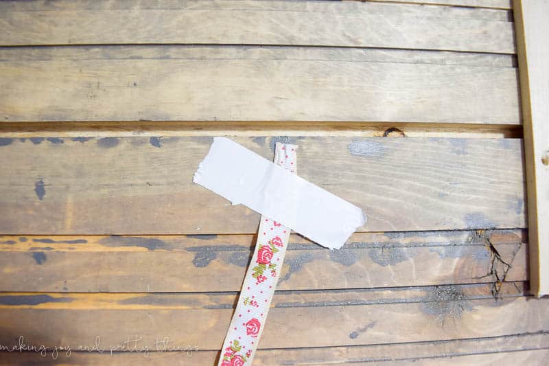 Secure your ribbon to the back of your holder using tape or any method then start wrappin the ribbone around your DIY Christmas card holder