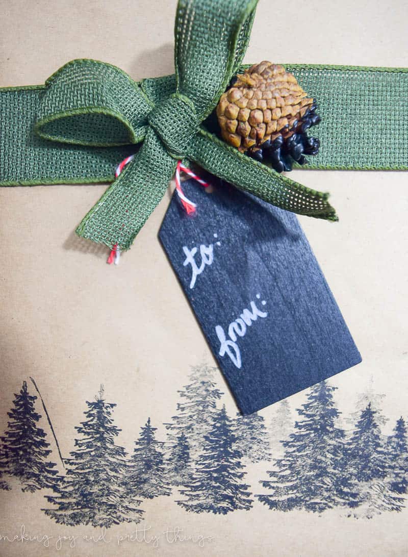 Add a rustic touch to your gift wrapping this Christmas season with dipped pinecone gift tags! This rustic gift wrapping adds a DIY touch to your gifts.