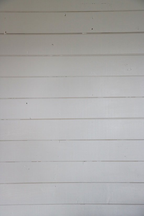 Am image of a bare white shiplap wall.