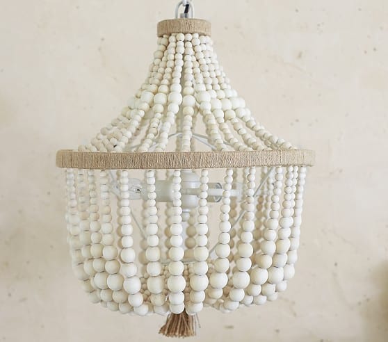 The inspiration for my diy wood bead chandelier - a similar wood bead chandelier from Pottery Barn.