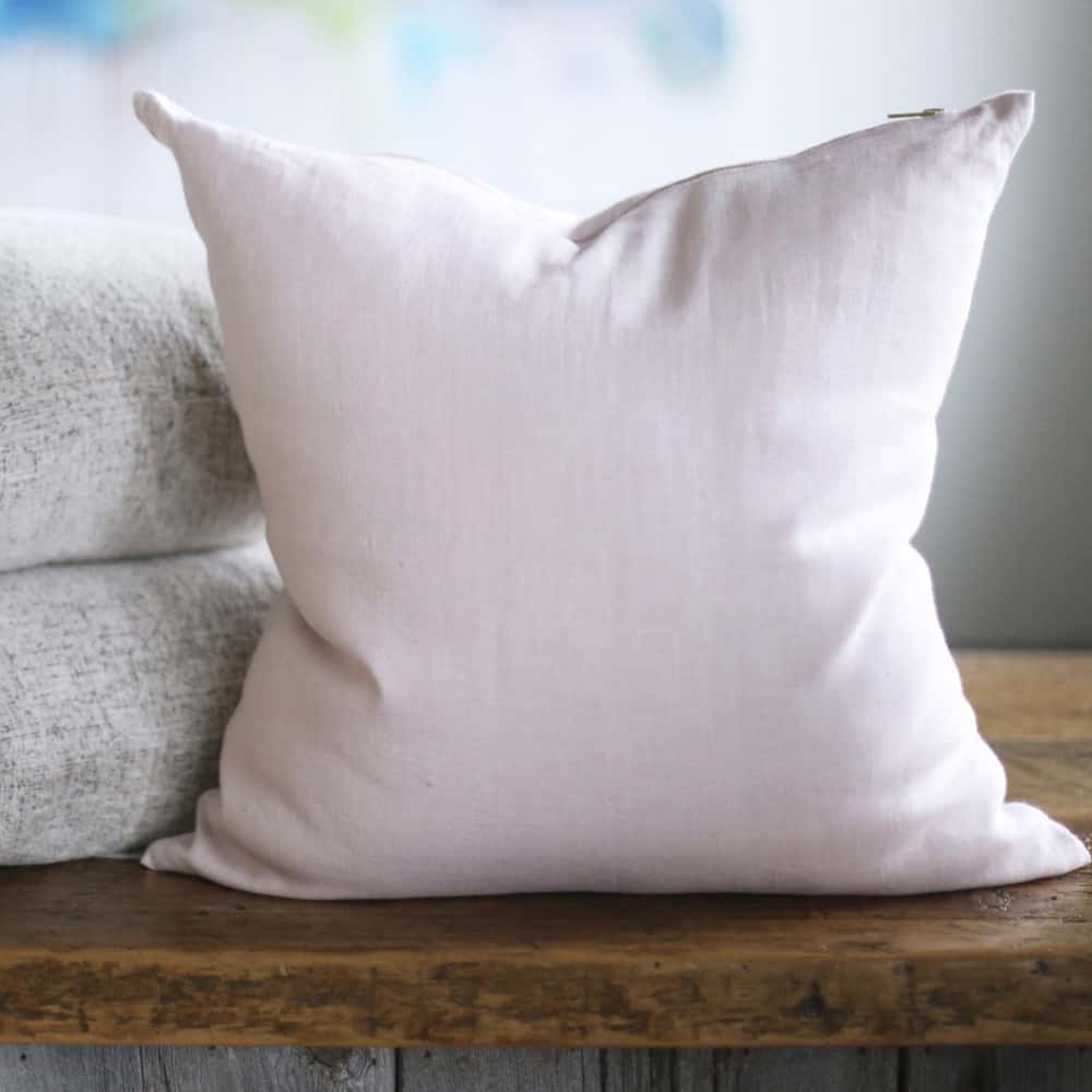 A plain white throw pillow insert.