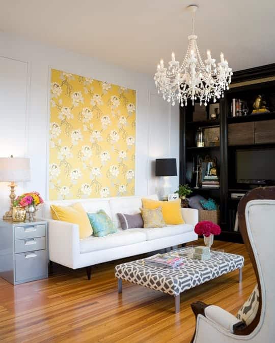 Yellow wallpaper used in a frame to decorate a living room is another creative way
