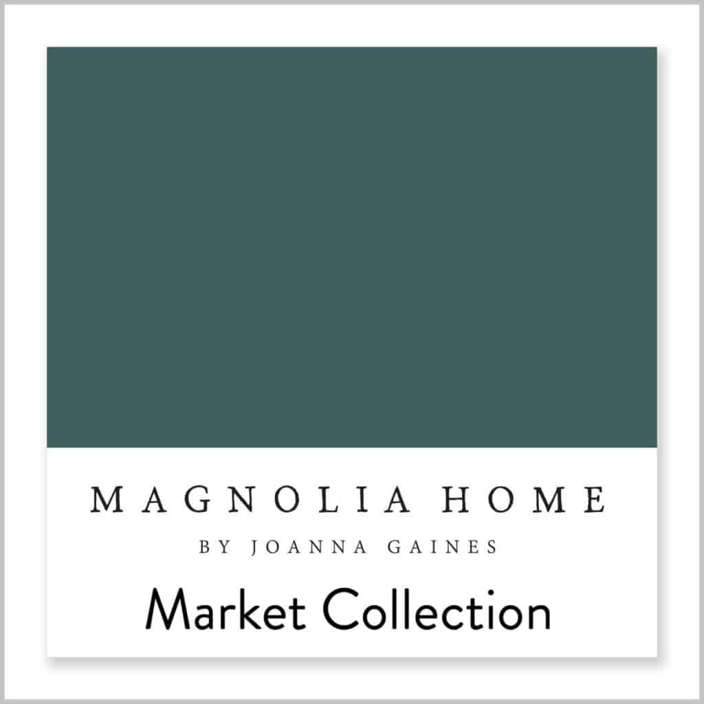 Weekend paint color from Magnolia Home is a a pretty jewel toned teal blue paint color that is bold and moody. It looks great painted on the top portion of the walls int this bathroom. 