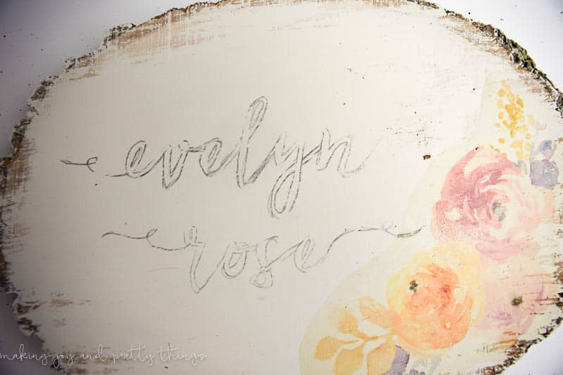 Tracing a name onto a wood slice is easy and is a great and simple how to make a wood name sign