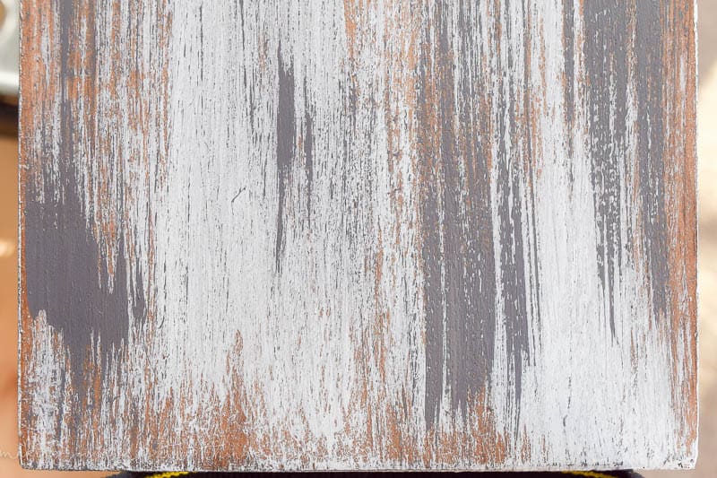 Complete distressed look on new wood for DIY rustic shelves in a farmhouse style