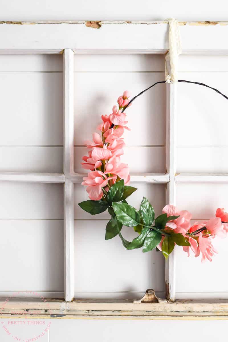 Up close look at the faux pink flowers from Michaels wrapped around a wire loop