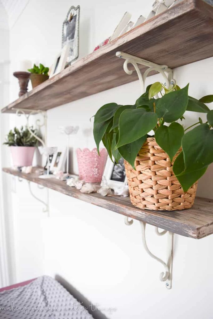 Looking for a way to add farmhouse decor in a girls nursery add these rustic shelves and accents to give you that look