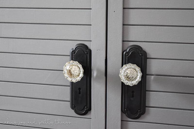 closeup of knobs on a closet door knobs with a clear farmhouse crystal style with keyholes add depth