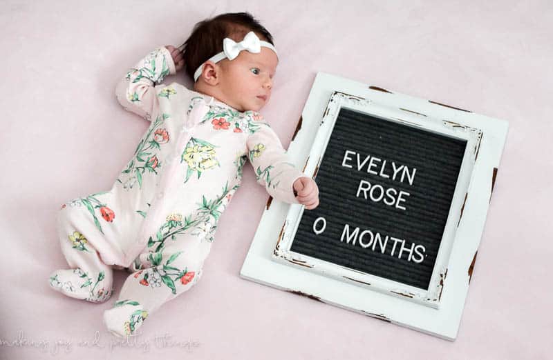 Newborn letter board that was a simple to do DIY with an old picture frame with dowels assembled on top of each other for a farmhouse look