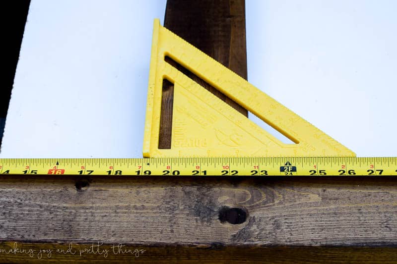 When adding a center beam to a frame use a tape measure and square to get your beam into the correct position