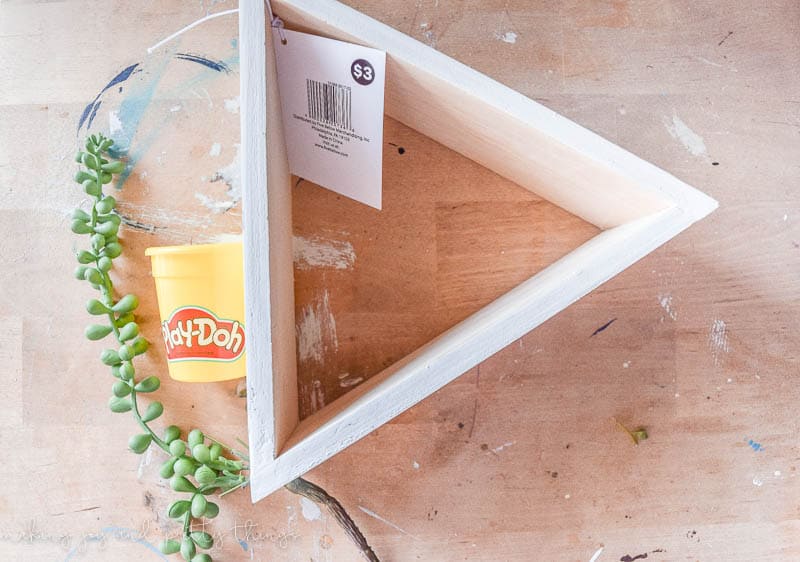 DIY Triangle Shelf Planter using a $3 Dollar Store Shelf and old play-doh container. Dollar store craft | DIY craft | upcycle | planter ideas | succulents