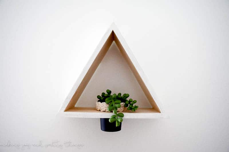 DIY Triangle Shelf Planter using a $3 Dollar Store Shelf and old play-doh container. Dollar store craft | DIY craft | upcycle | planter ideas | succulents