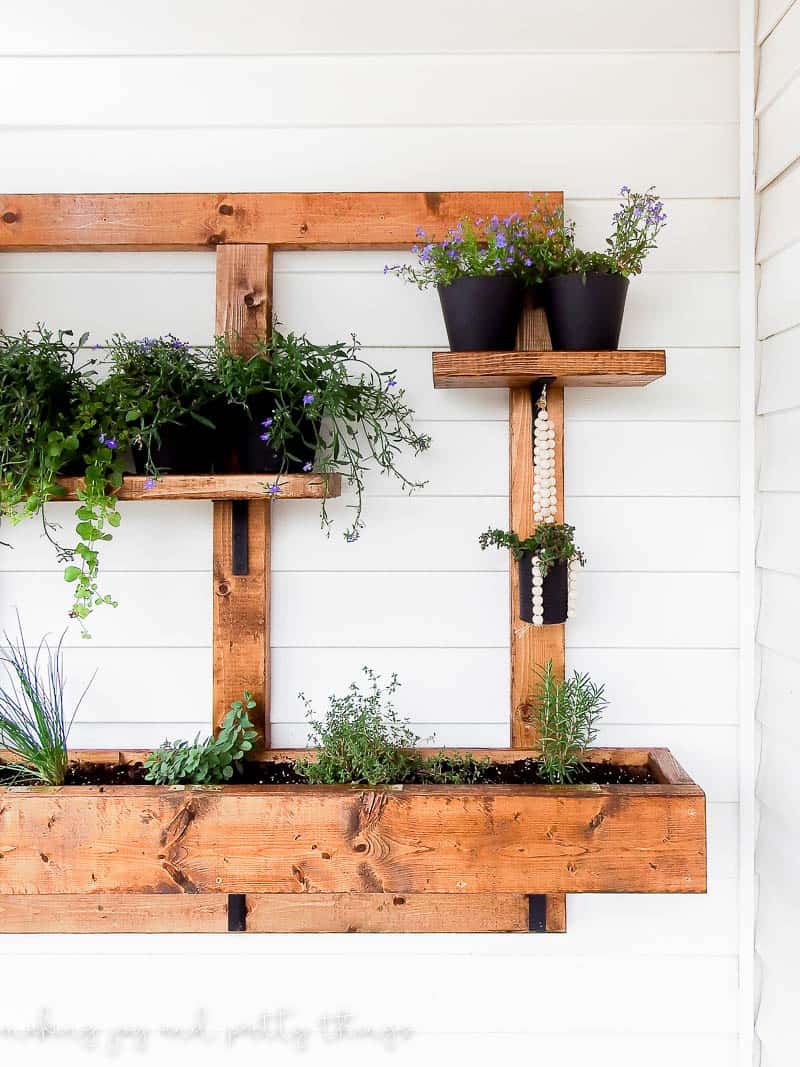 If you want to anchor something to exterior siding be sure to make a sturdy planter box frame to handle the weight