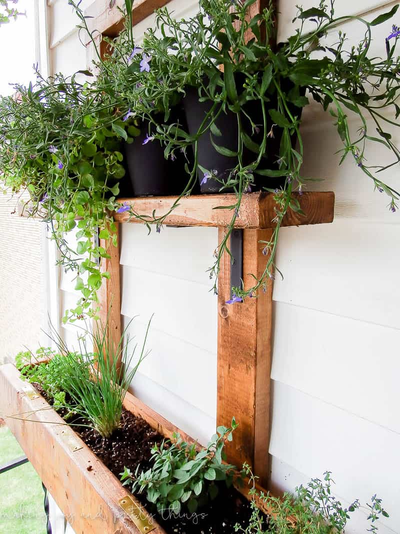 DIY vertical herb garden with pots and planter options for all the herbs you could ever want hung outside