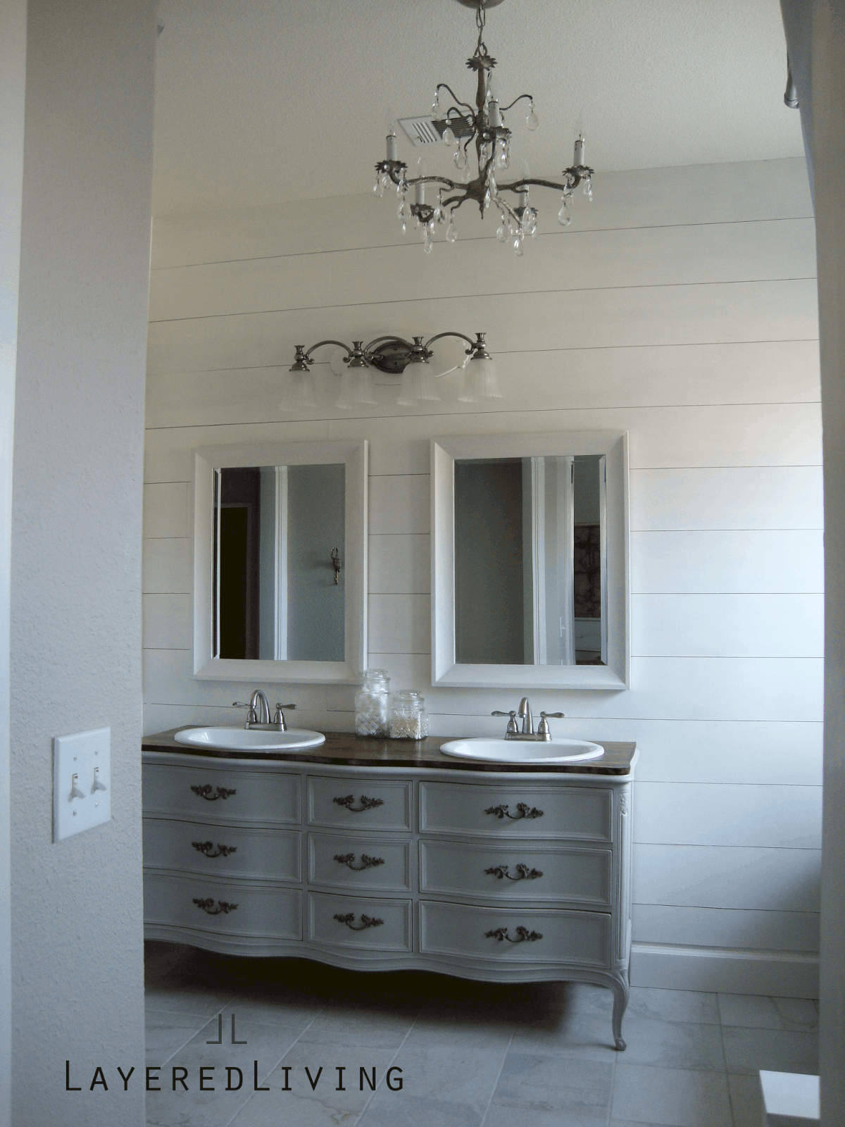 Convert an old dresser into a vanity to give a charming unique look to your bathroom remodel 