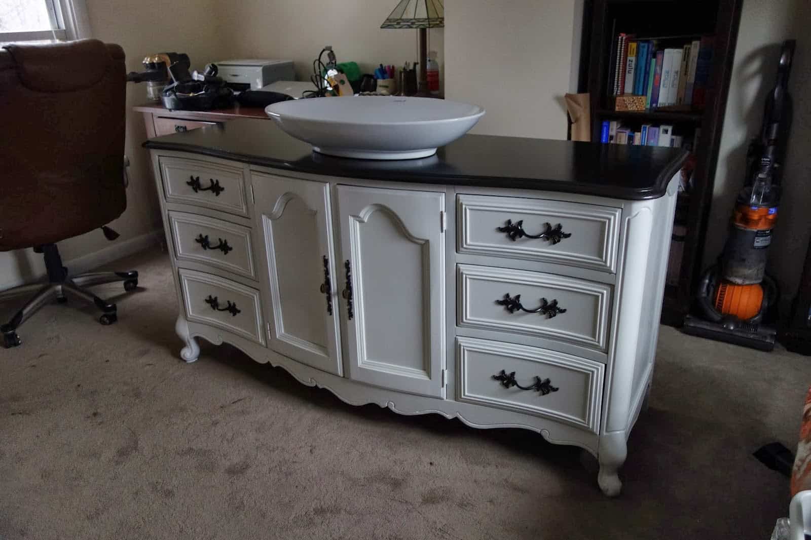 Making bathroom vanities made out of old dressers is simple when you pick a matching sink and hardware to give that vintage feel