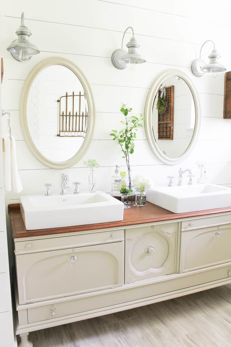 Farmhouse oversized diy bathroom vanity made with an old dresser by adding sinks and faucets 