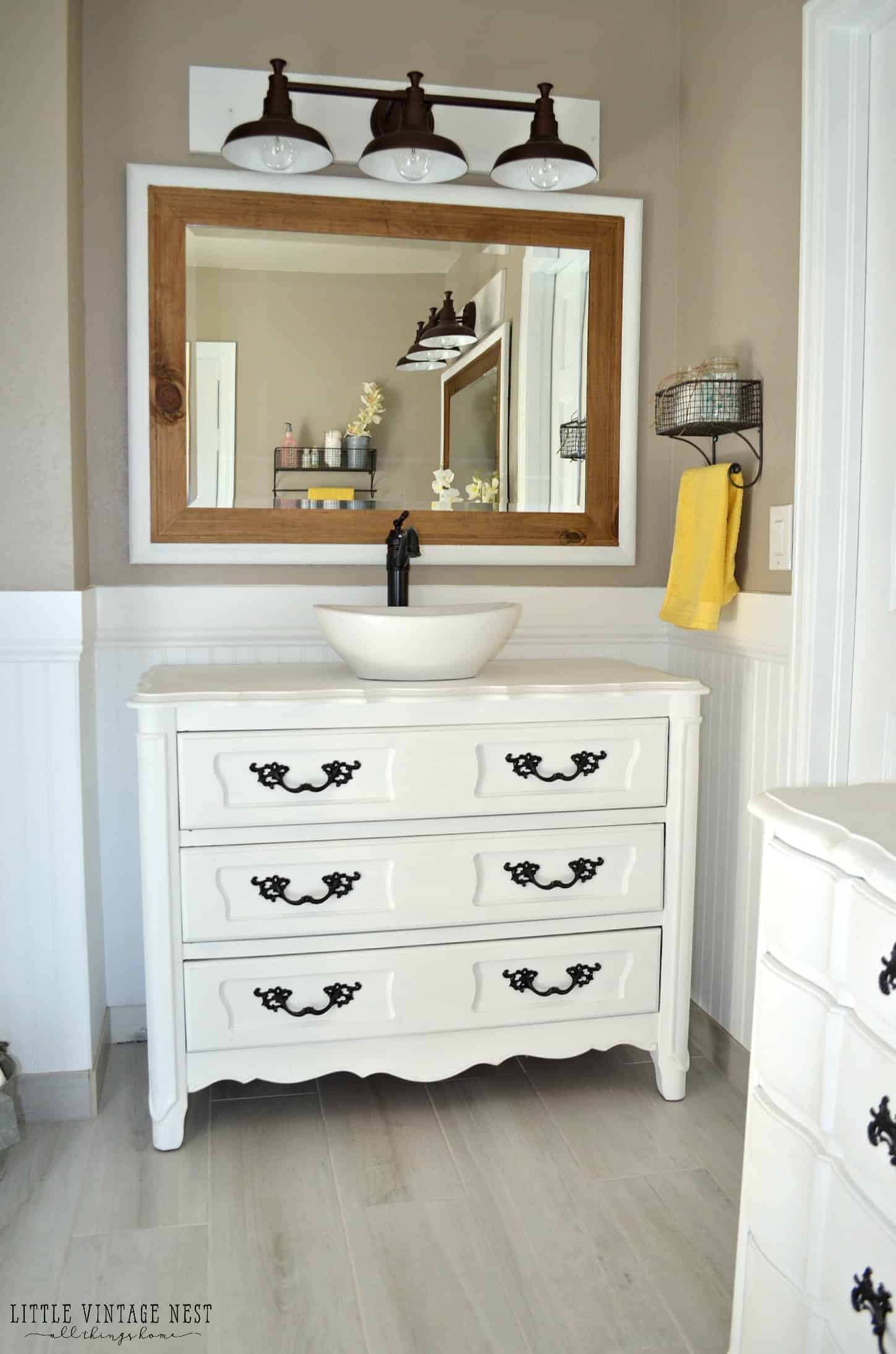 Get inspired by this vintage look in a bathroom remodel with modern fixers that provides great contrast