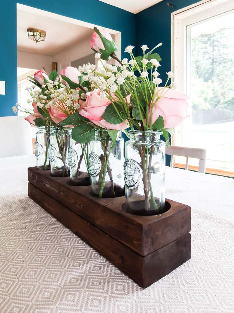 Finished look at a DIY wood centerpiece that was done in a farmhouse style is a beautiful idea for your dining room table