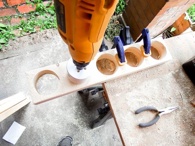 Top down view to see through and learn what a hole saw does and how it works for this DIY wood centerpiece in a farmhouse style