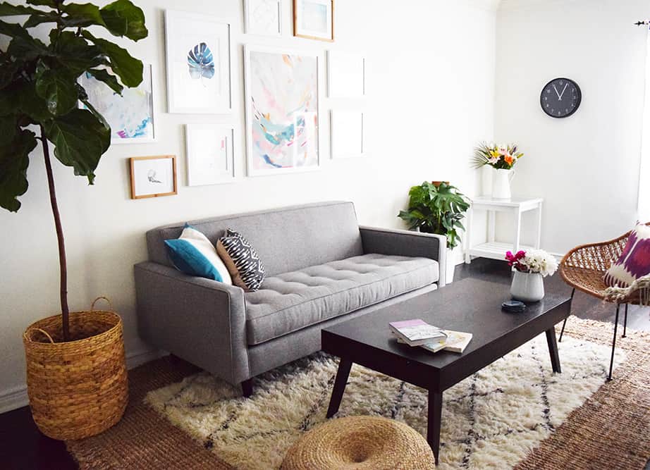 A Shaggy neutral rug can be used over a natural fiber rug in the living room to add pops of color with throw pillows and other decor.