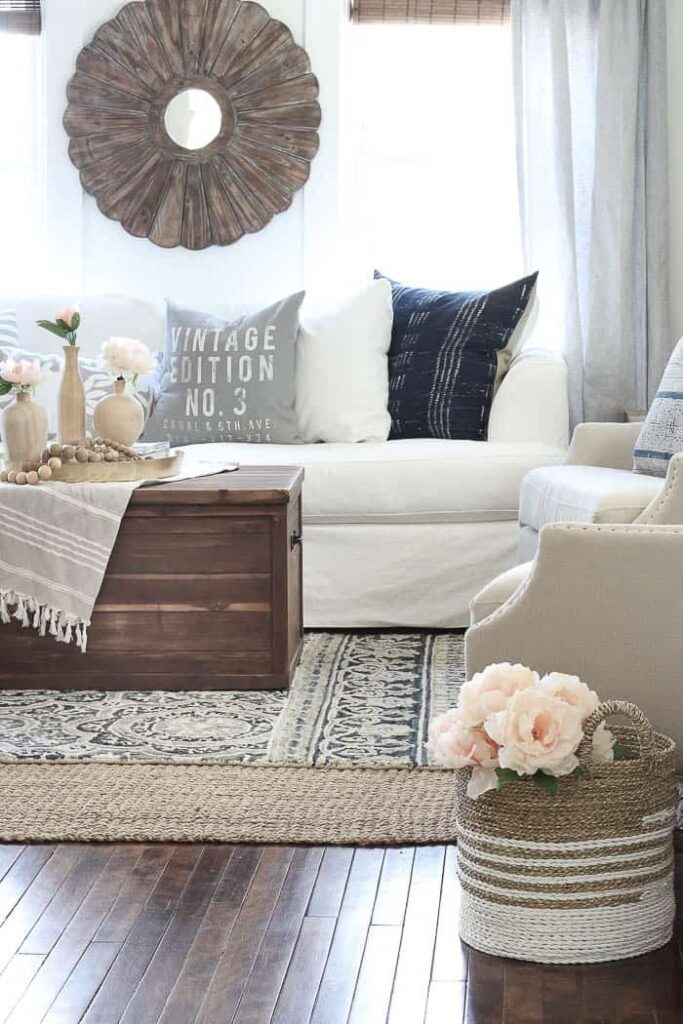 A photo of a neutral patterned rug on the floor of a dining room, creating an interesting texture.