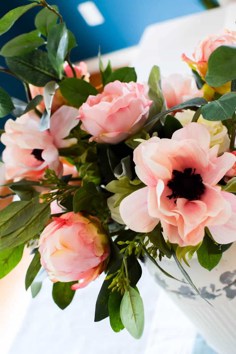 This farmhouse floral arrangement inside an old vintage milk can is just one of many ideas that could be done