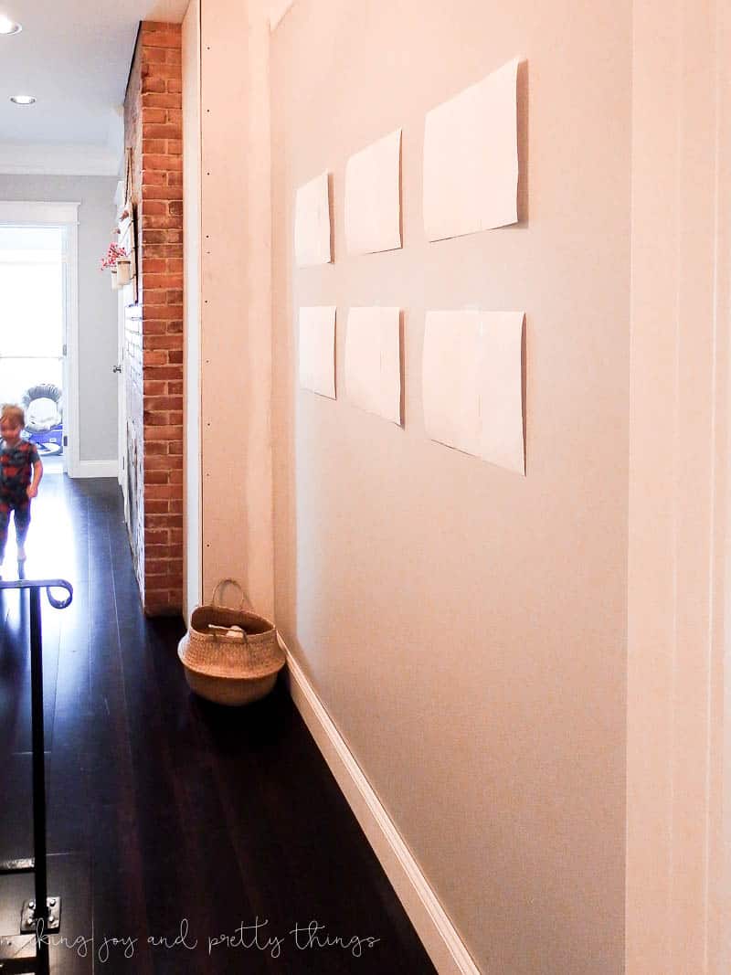 Farmhouse hallway decor ideas using paper to see how a gallery wall would look in a hallway before hanging frames