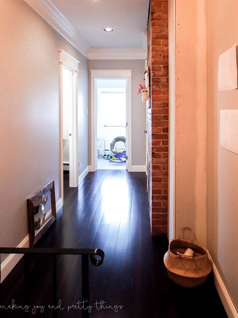 Clean hallway in builder grade materials and flooring to explore adding farmhouse hallway decor