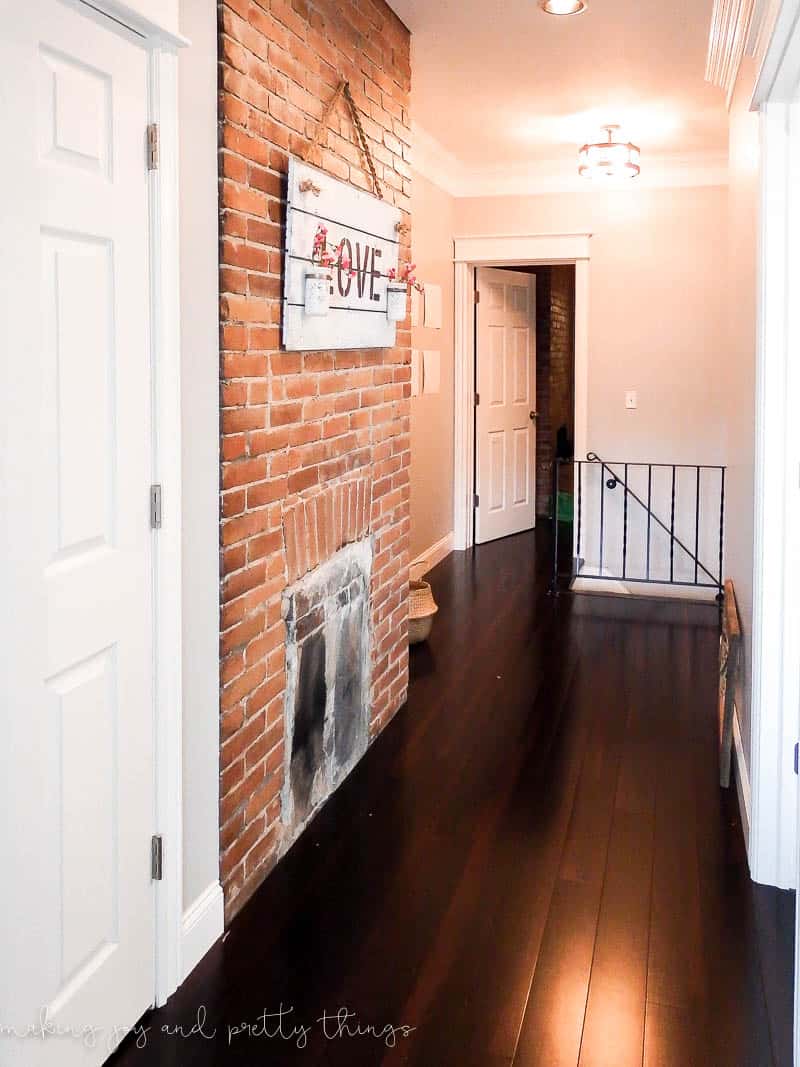 Hallway with Chimney and new flooring needing a style update with farmhouse notes and decor ideas