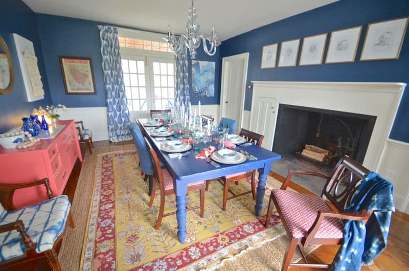 Another photo of a Sisal rug with a southwestern patterned vintage rug on the dining room floor.