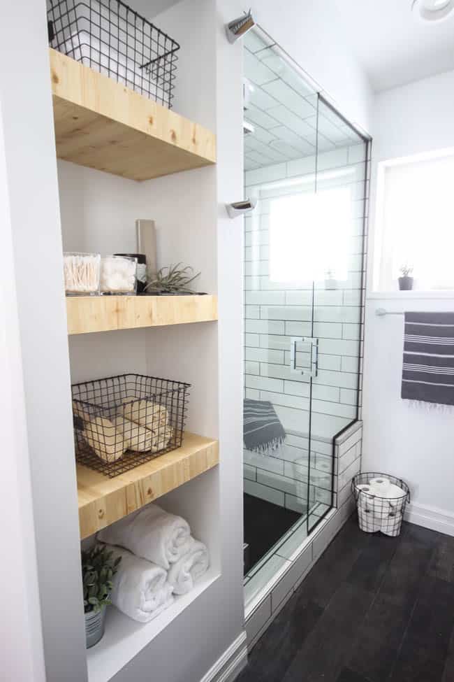 DIY shelving is a great way how to save money on a bathroom remodel by getting shelving where you can