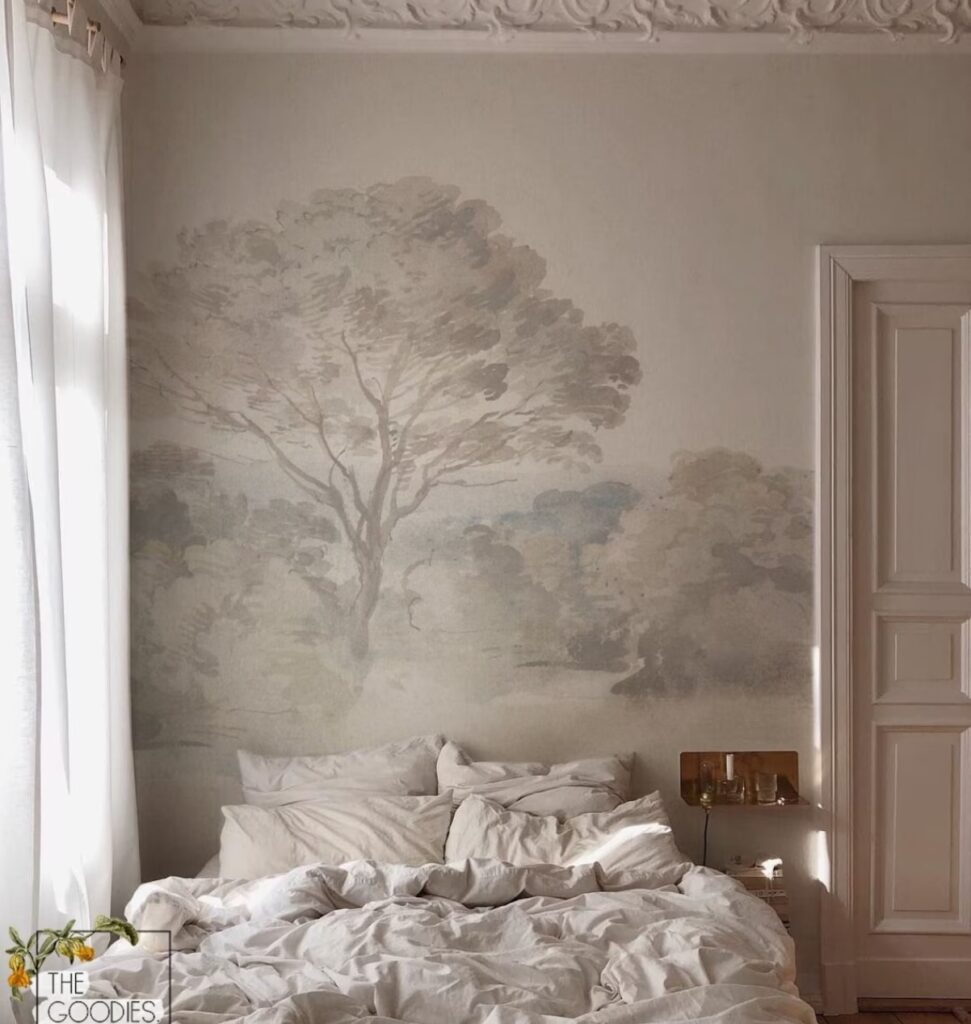 Cute bedroom with tree-printed wallpaper mural is a great idea.