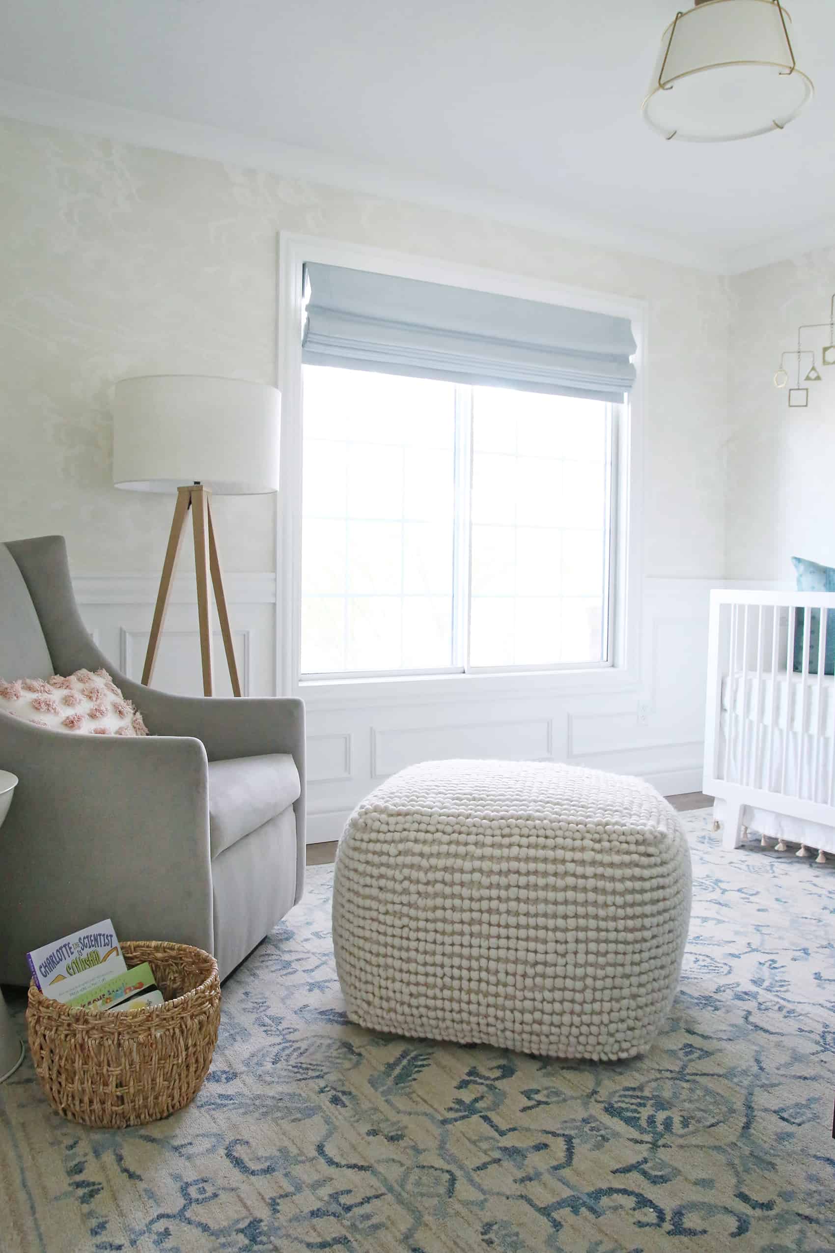 A wallpaper ideas for a nursery space on the nursery room with subtle cloud pattern 