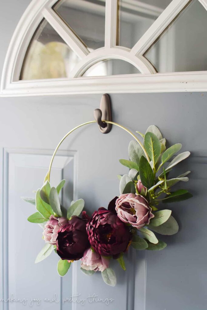 Beautiful Fall wreath with a gold macrame ring and violet faux flowers made as a fall decoration for front door