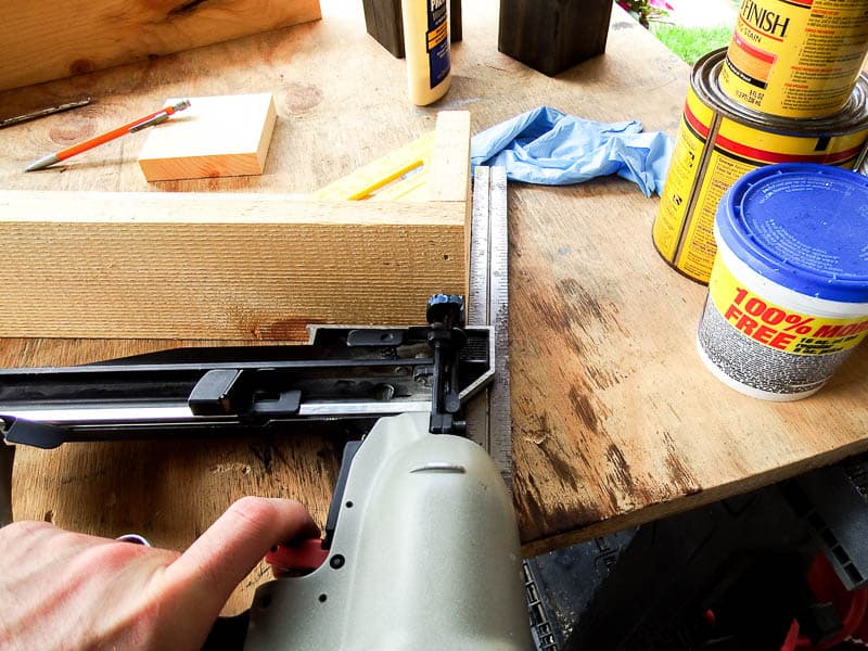 Using the finish nailer to connect the wooden box and leaving the nail holes exposed to have a rustic look