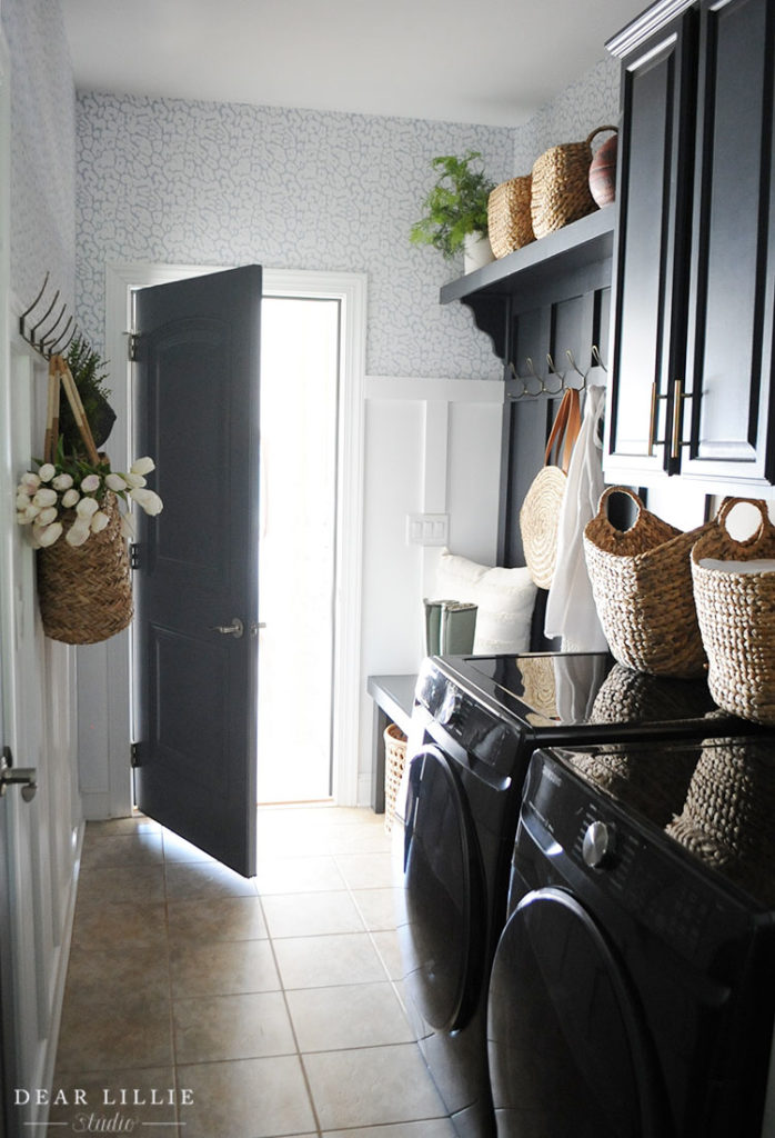 Laundry room with white board and batten on bottom and wallpaper on top