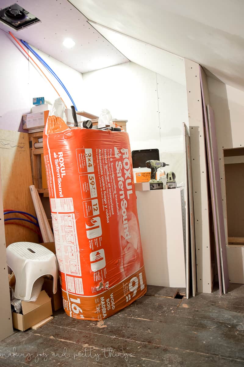 All the construction supplies is rounded up in a corner of a master bathroom during the renovation. 