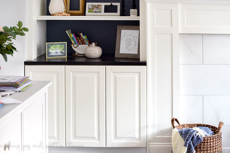 Create open shelving and countertop space using IKEA built ins around fireplace. These kitchen cabinets will provide tons of storage options.