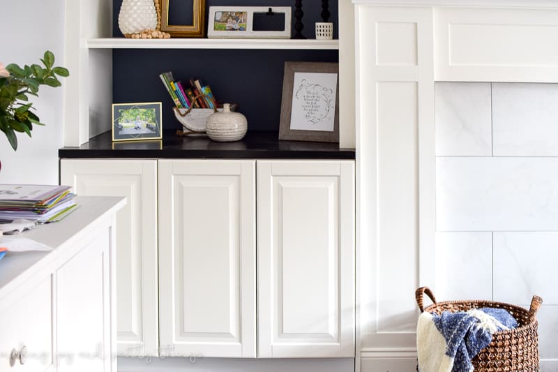 These IKEA kitchen cabinets installed as living room built-ins hide a lot of toys, books and games in our living room 