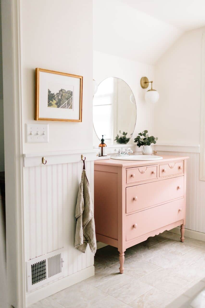 using an old dresser that has been converted into a bathroom vanity can add a rustic and farmhouse character feel