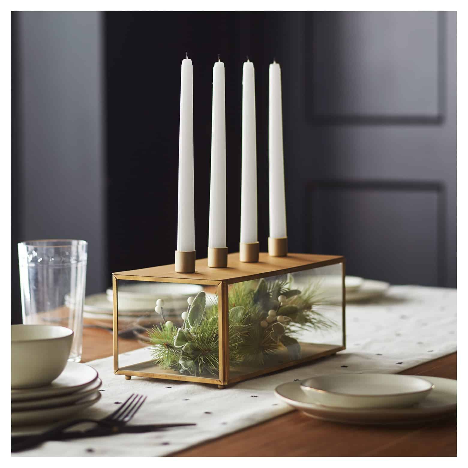 A photo of a candle set on a table.