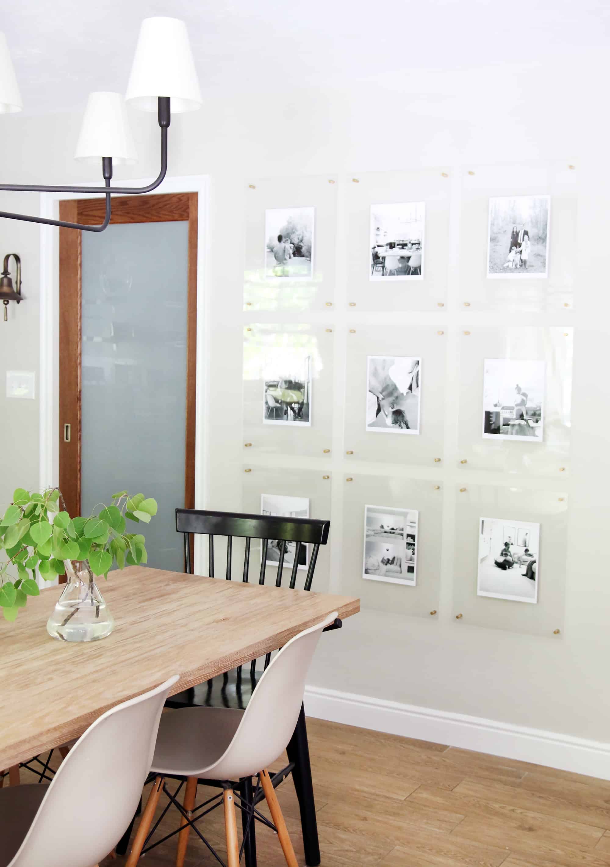 If you are wondering where to hang family photos in your home look at this amazing gallery wall in the dining room. This is a tasteful way to hang family photos on a gallery wall.
