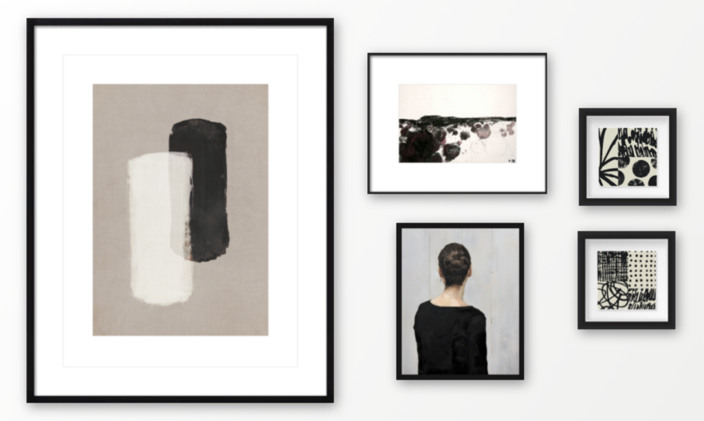 A gallery wall of 5 photo frames in a modern monochrome theme.