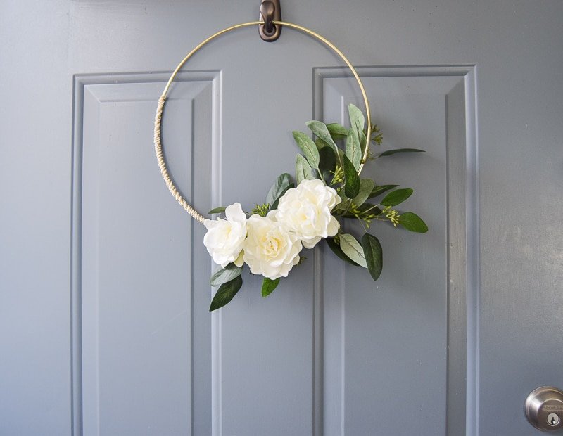 Front doors are hard to decorate for an entire season unless you pick the right decoration that has some beautiful floral and greenery notes