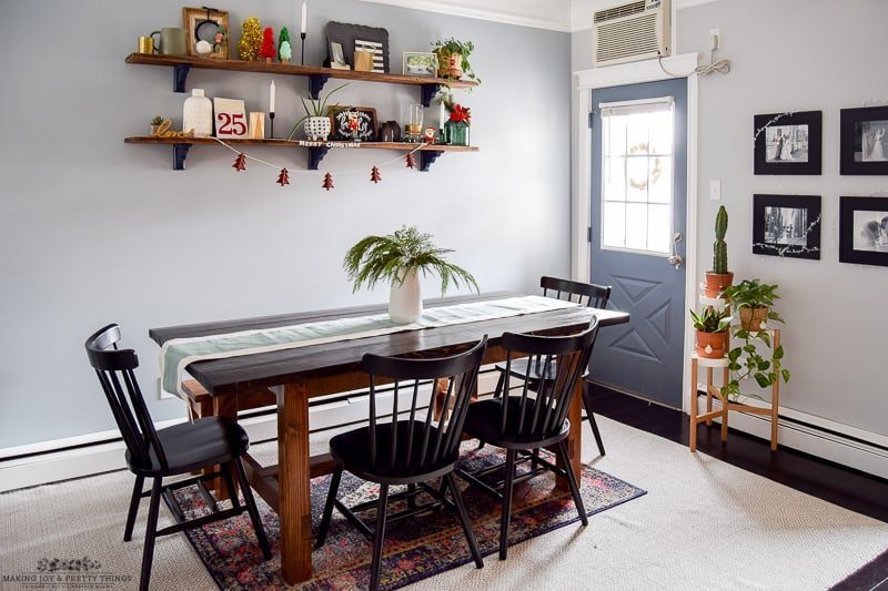 View of an entire decorated table with holiday accents throughout in a minimalistic fashion