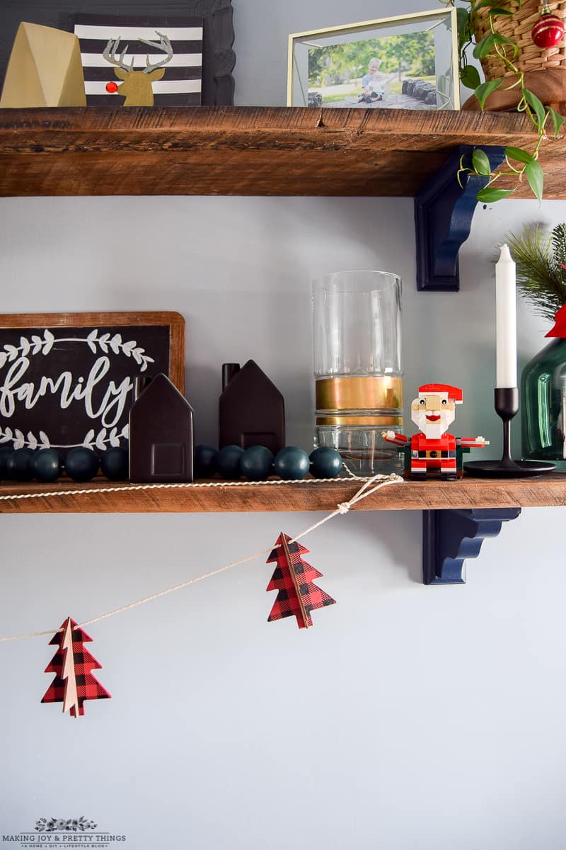 You can use all sorts of mediums and materials to decorate a dining room with Christmas decor